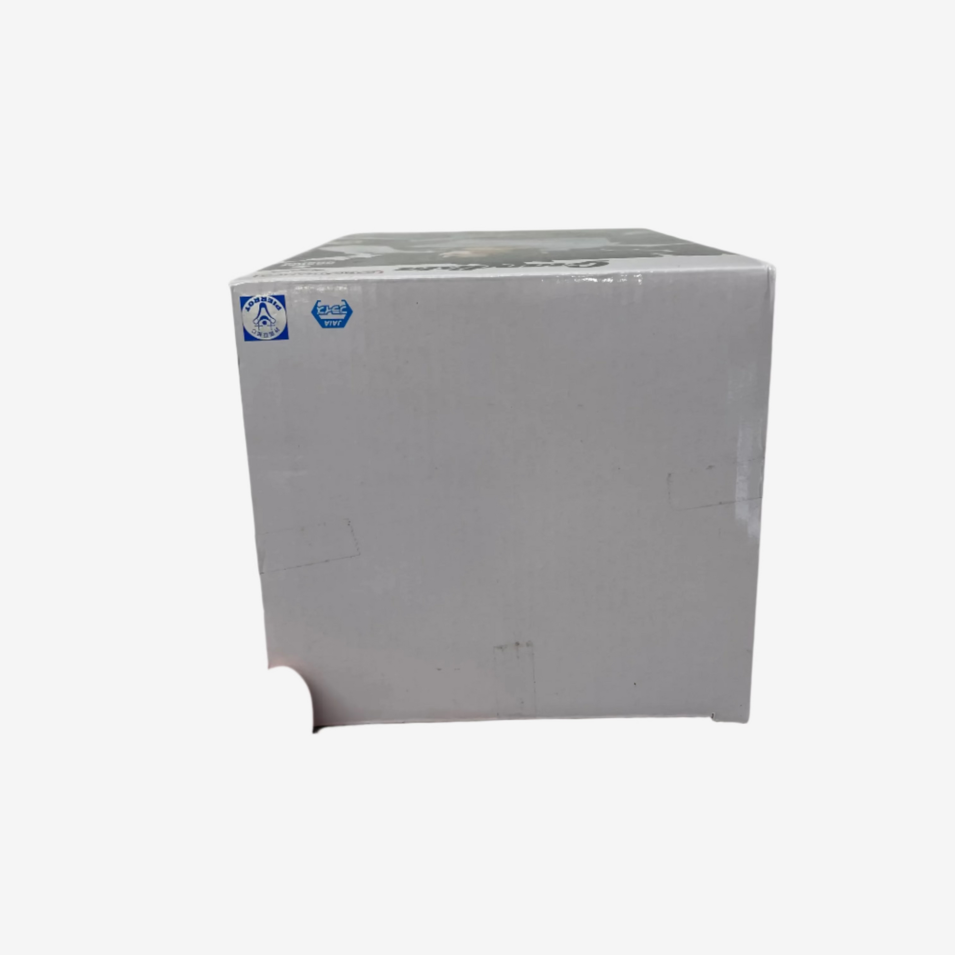 White box held by a hand with a ring on a white background