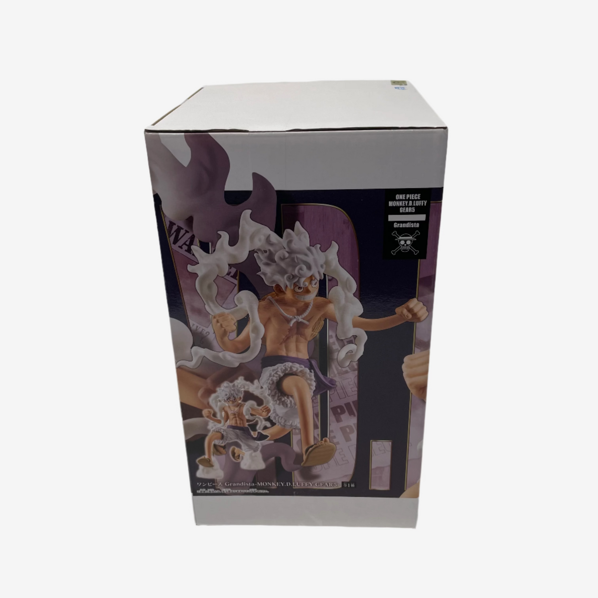 Boxed figurine with detailed design on a white background