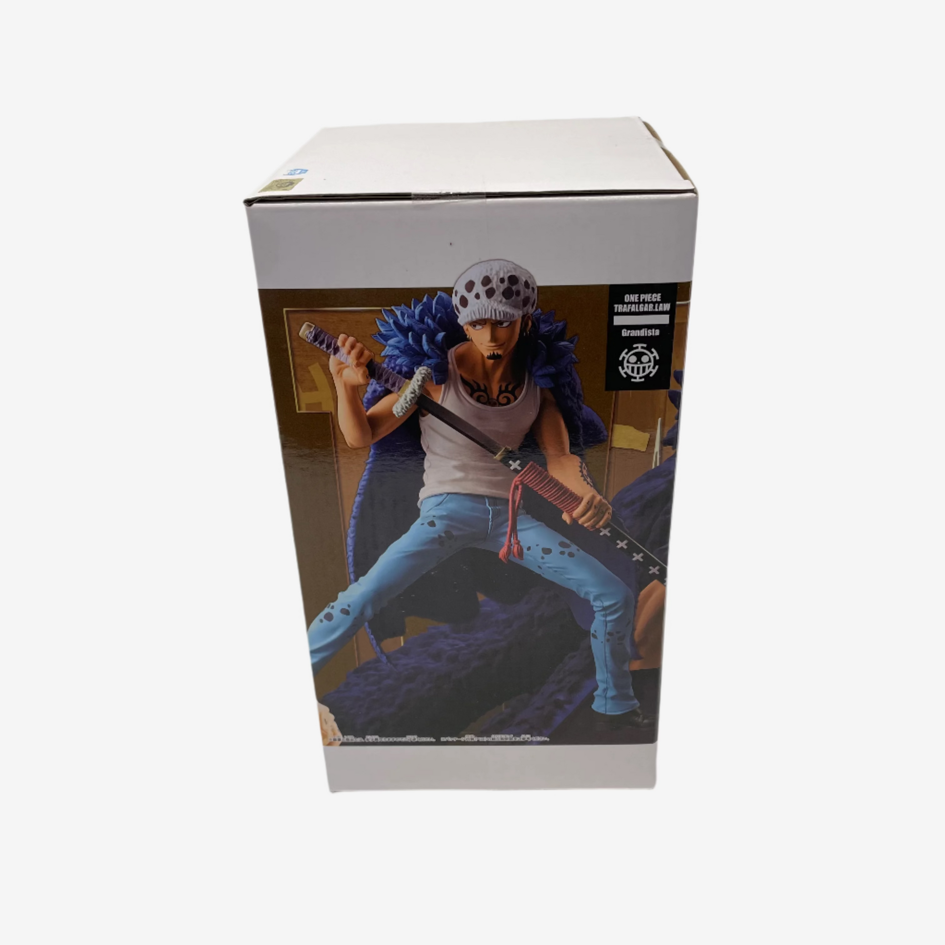 Boxed action figure with a character holding a weapon on a white background
