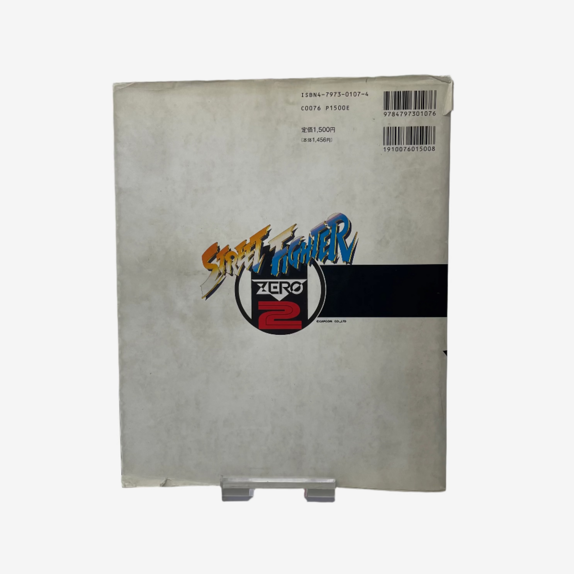 Vintage 'Street Fighter Zero 2' game case on a white background