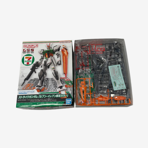 Model kit packaging with a robot figure and its components on a white background