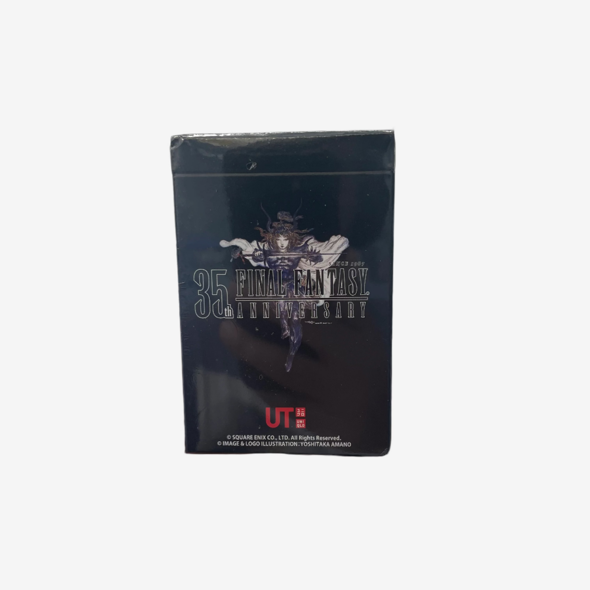 Hand holding a small black box with 'Final Fantasy' branding against a plain background