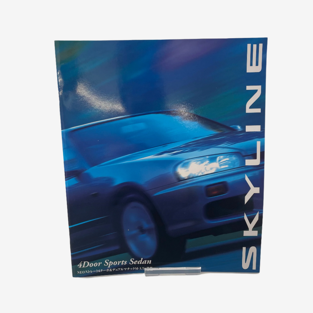 Brochure or promotional material for a blue car model with 'SKYLINE' branding on a white background.