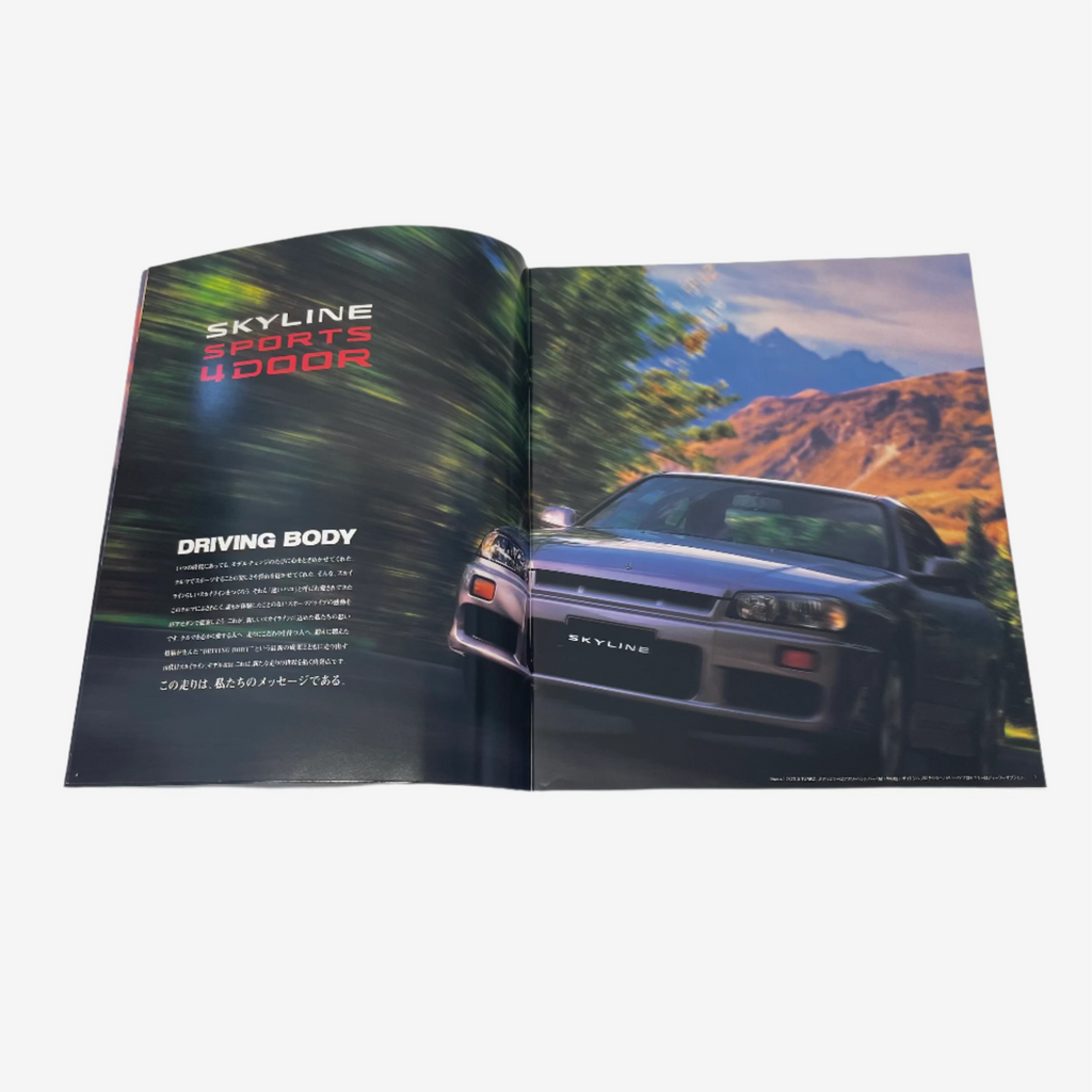 Open book showing a car on one page and text on the other, with 'SKYLINE' branding.