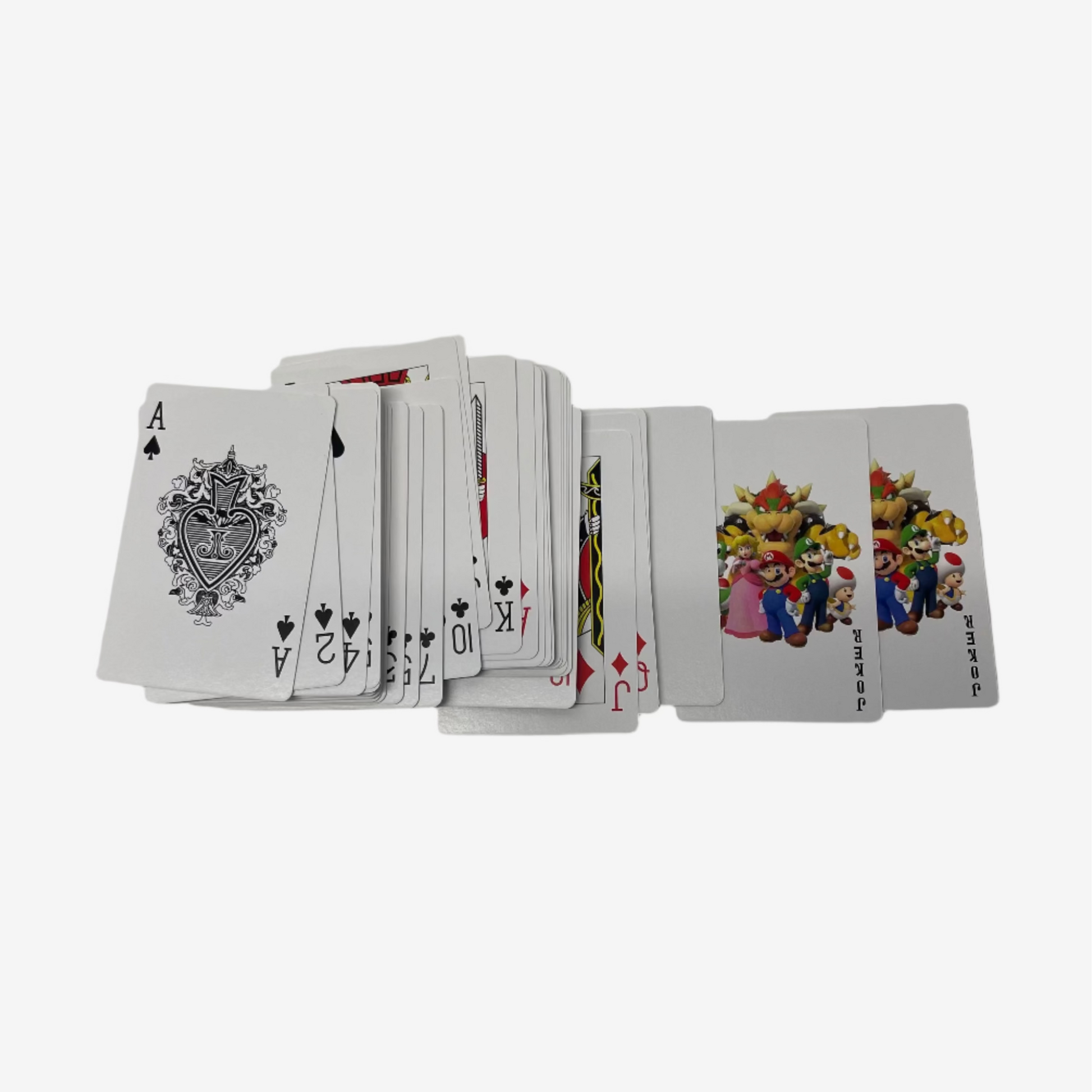 Playing cards stacked on a white surface