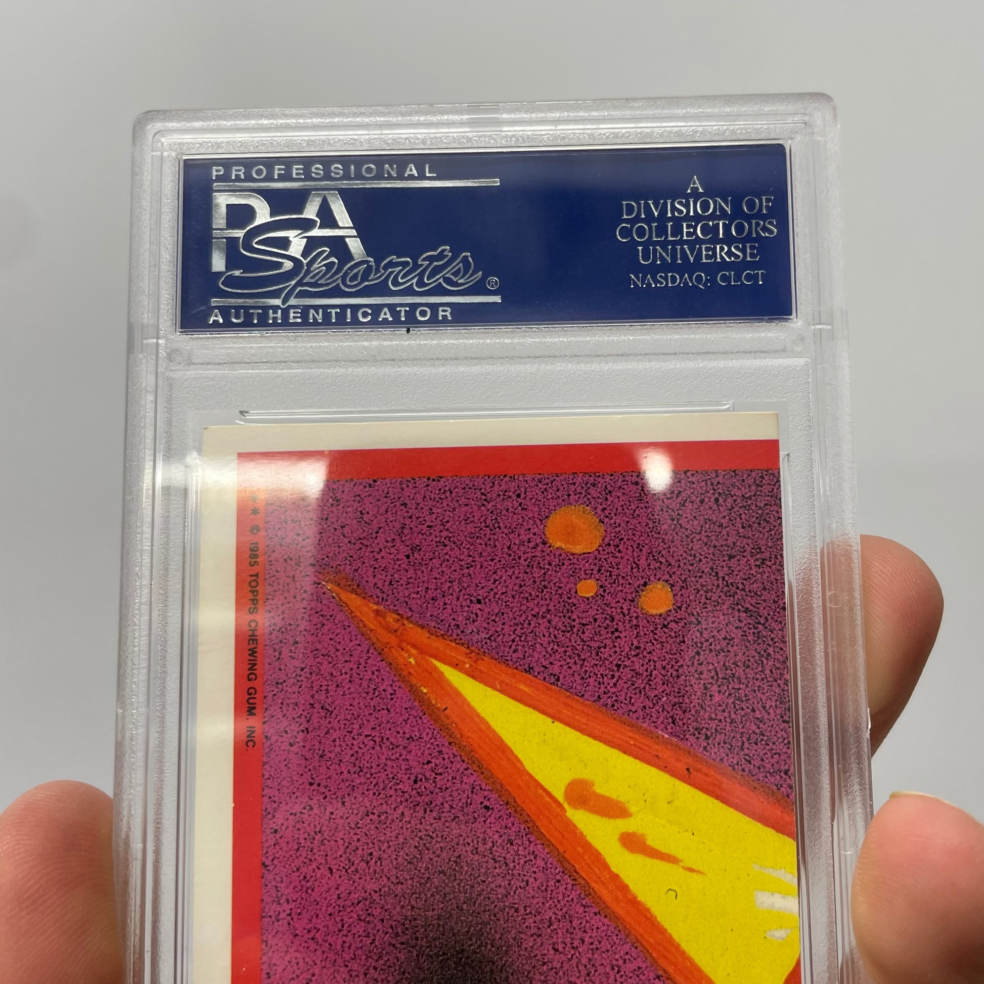 Trading card in a PSA Sports holder against a gray background