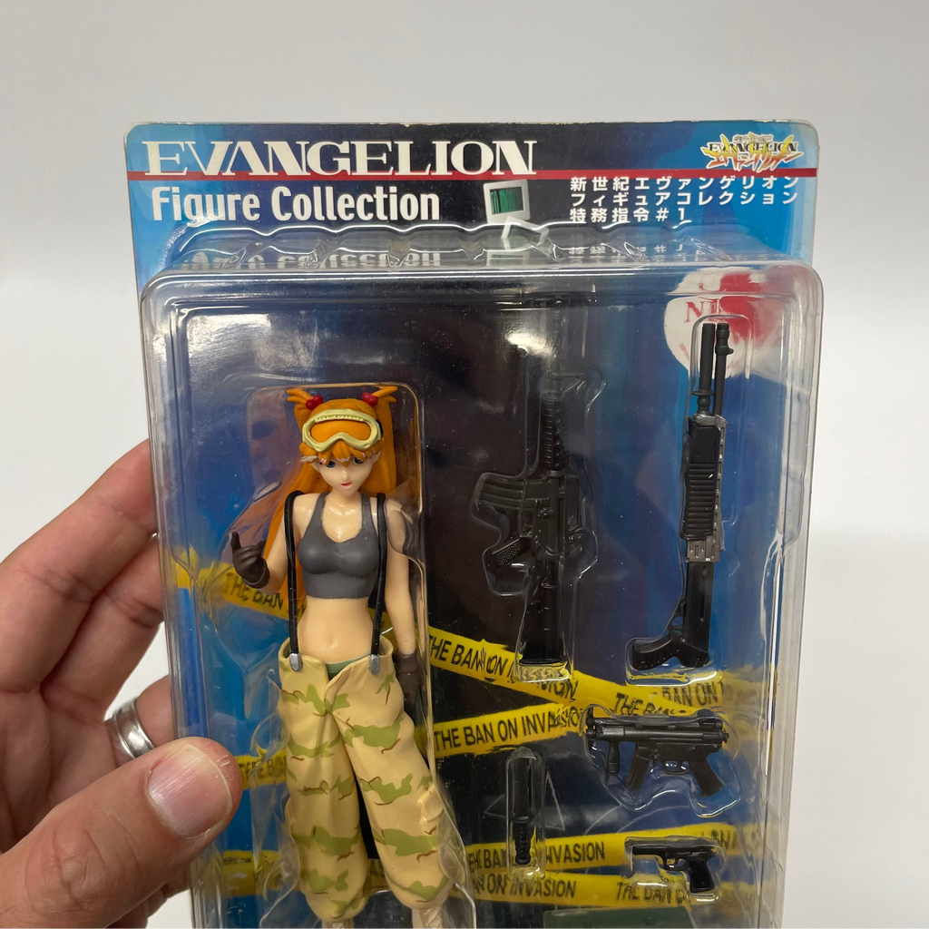Action figure in packaging with 'Evangelion' branding