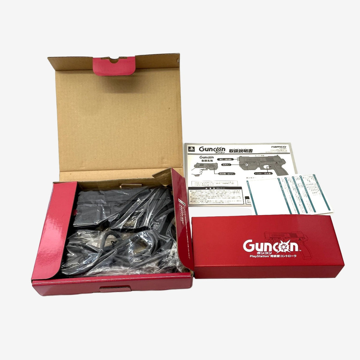 Gundam model kit with open box on a white background
