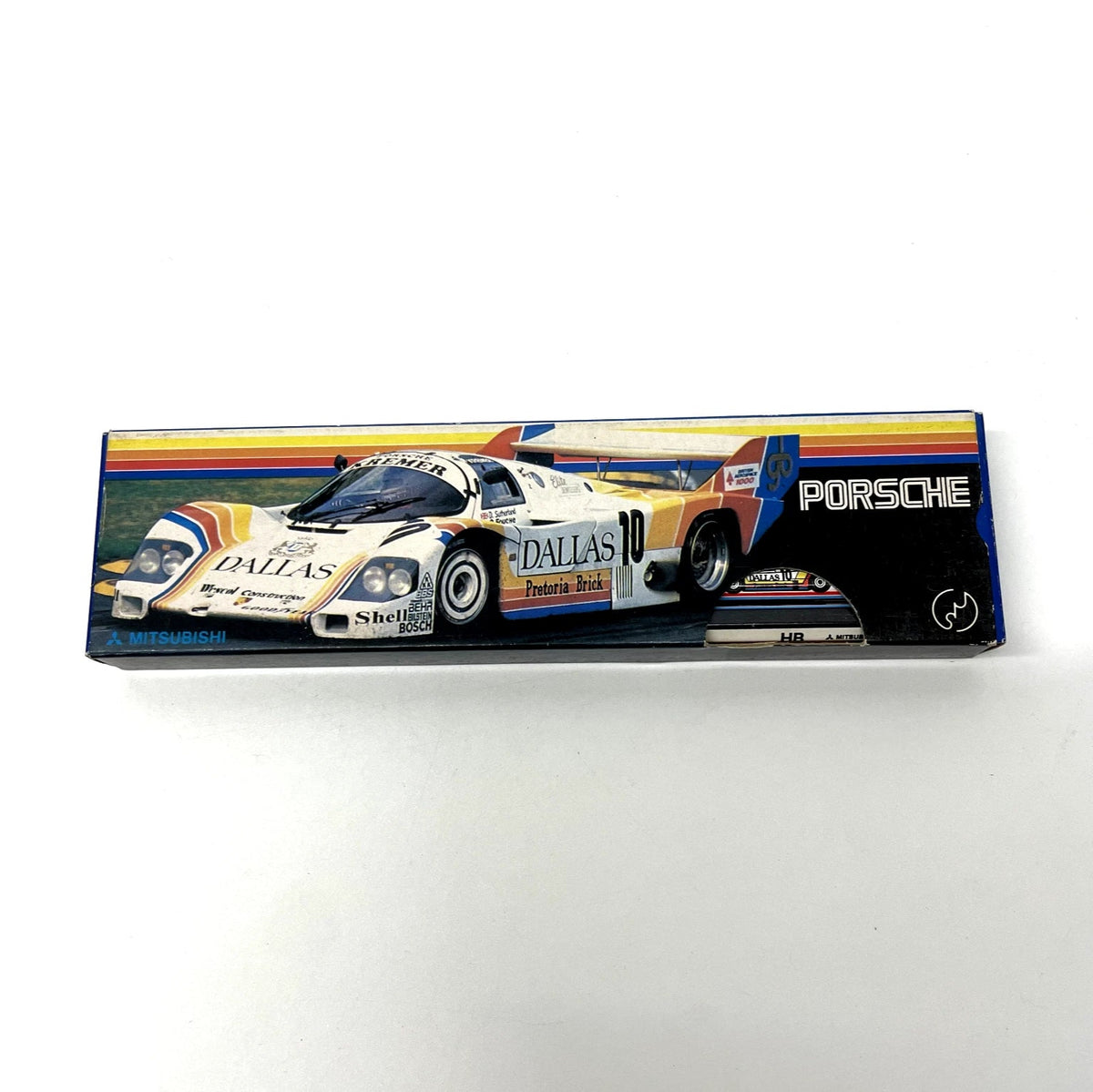 Model car packaging with Porsche branding on a white background