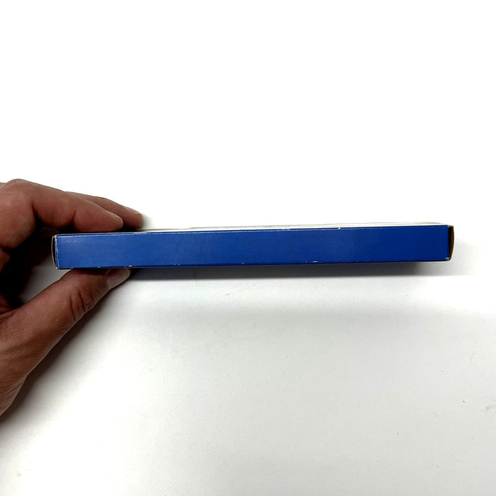 Hand holding a blue rectangular object against a white background