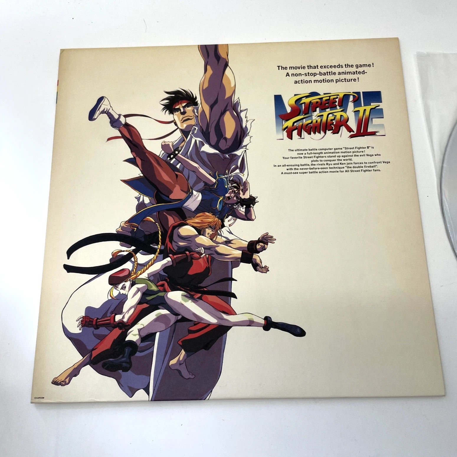 Vinyl record cover for 'Street Fighter II' with animated characters and promotional text.